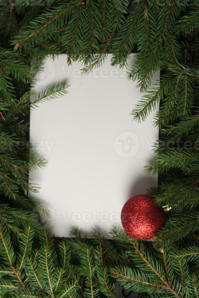 Holidays greeting card or banner composition with pine tree branches. Merry Christmas background and Happy New Year 2023. photo