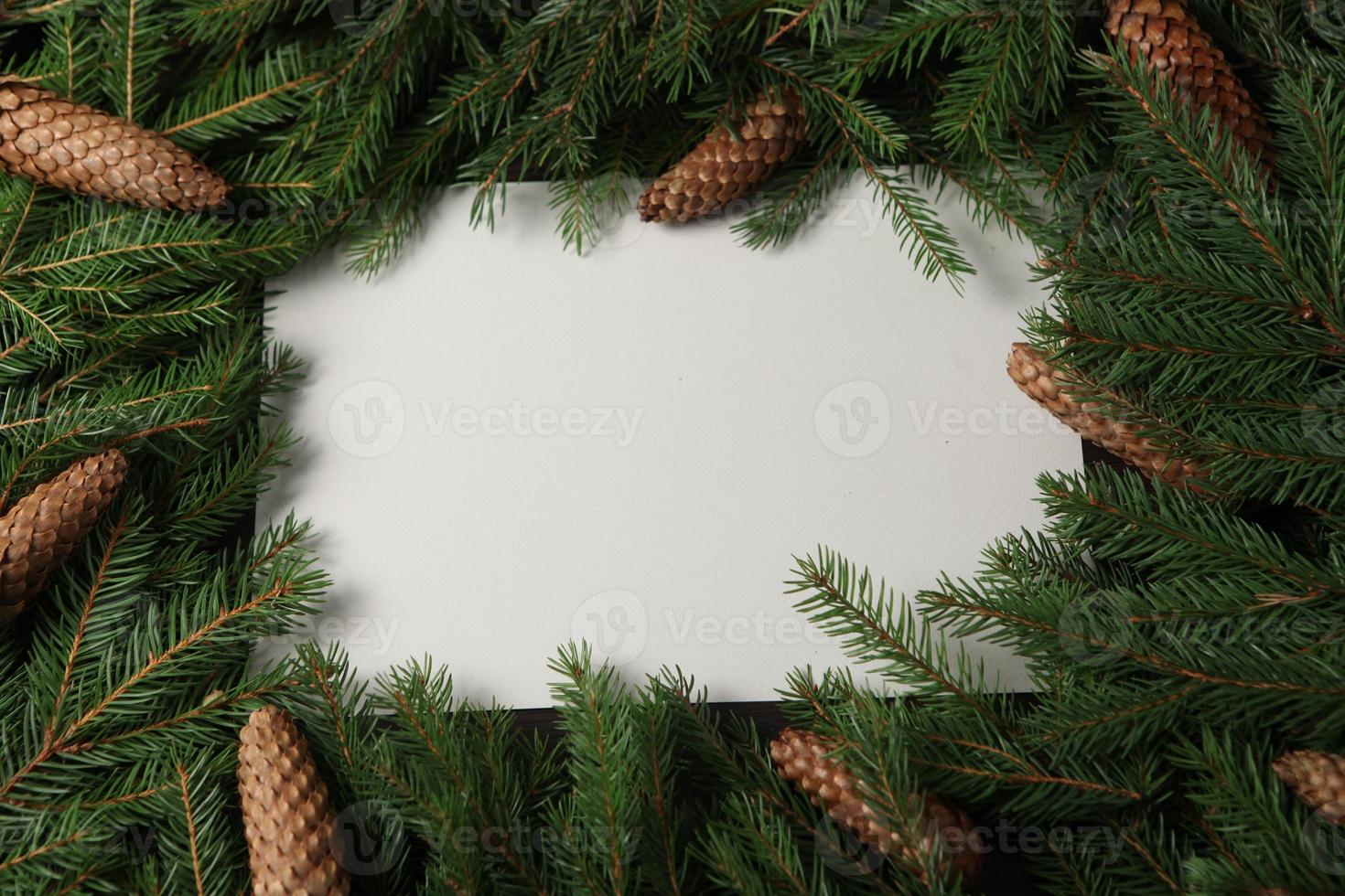 Holidays greeting card or banner composition with pine tree branches. Merry Christmas background and Happy New Year 2023. photo