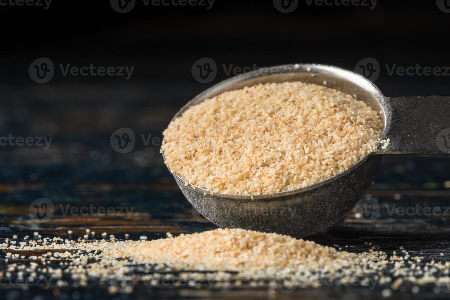 Garlic Powder Spilled from a Teaspoon photo