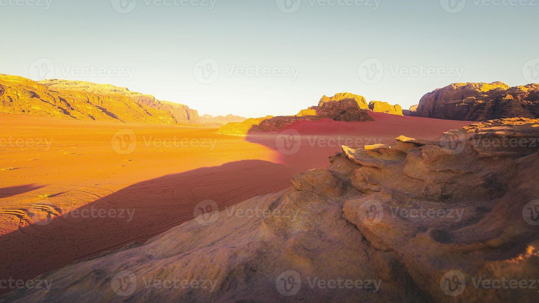 Planet Mars like landscape - Photo of Wadi Rum desert in Jordan with red pink sky above, this location was used as set for many science fiction movies