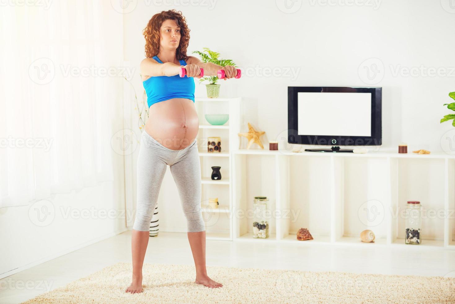 Pregnant Woman Exercising photo