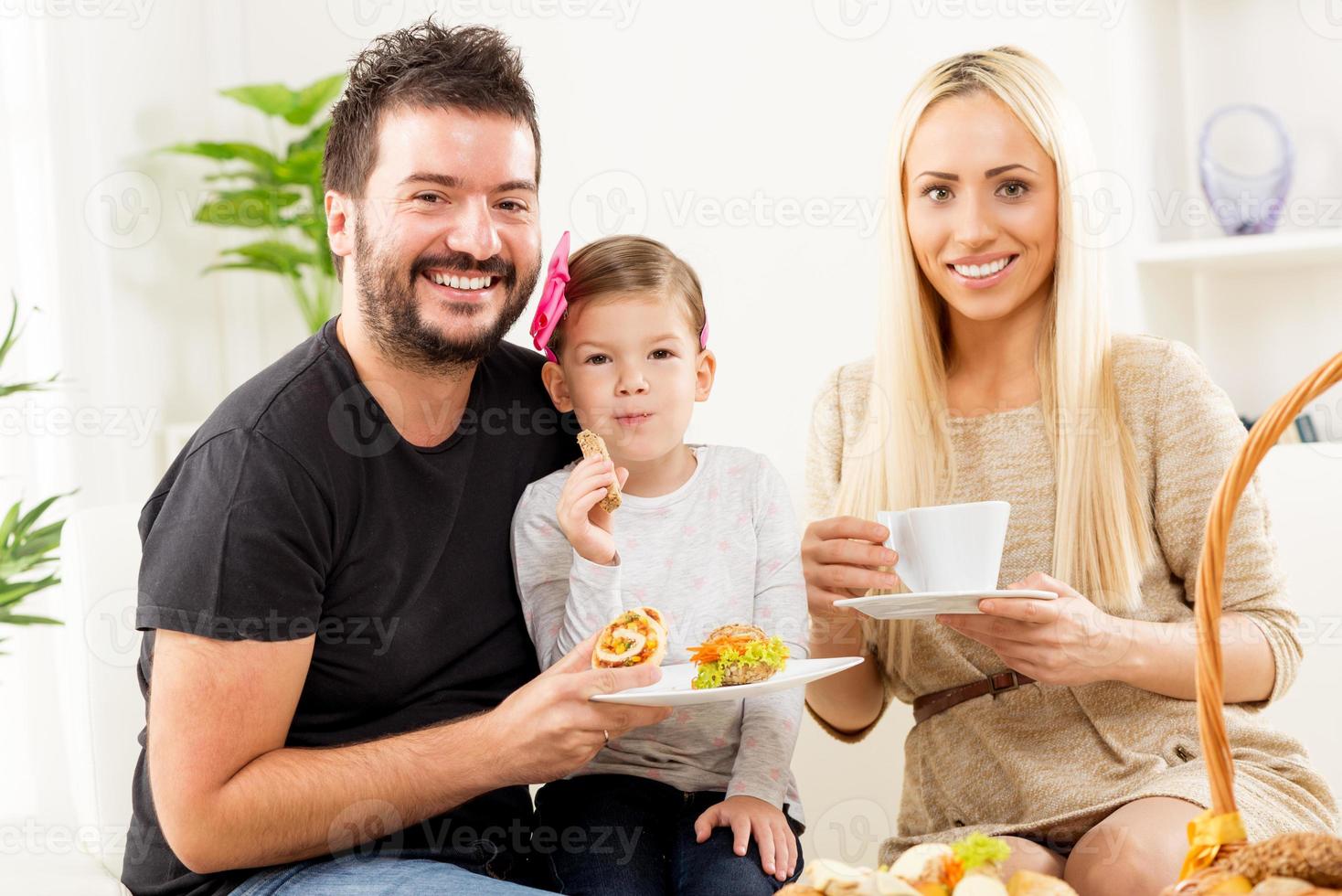 Happy Family Eats Pastry For Breakfast photo