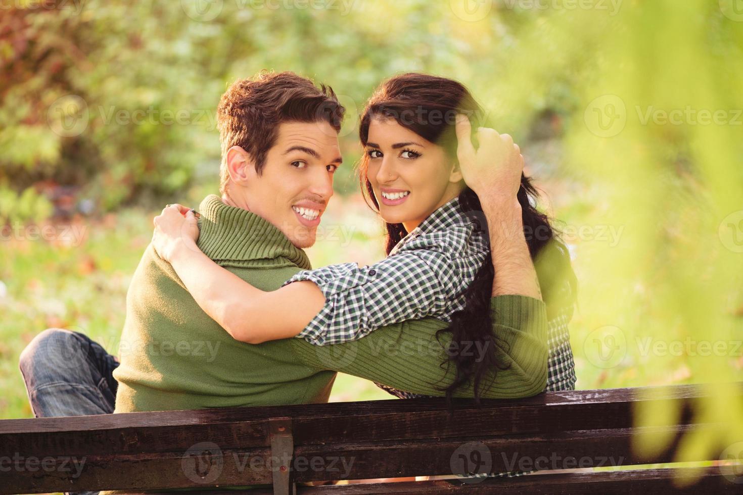 Young Couple On A Park Bench photo