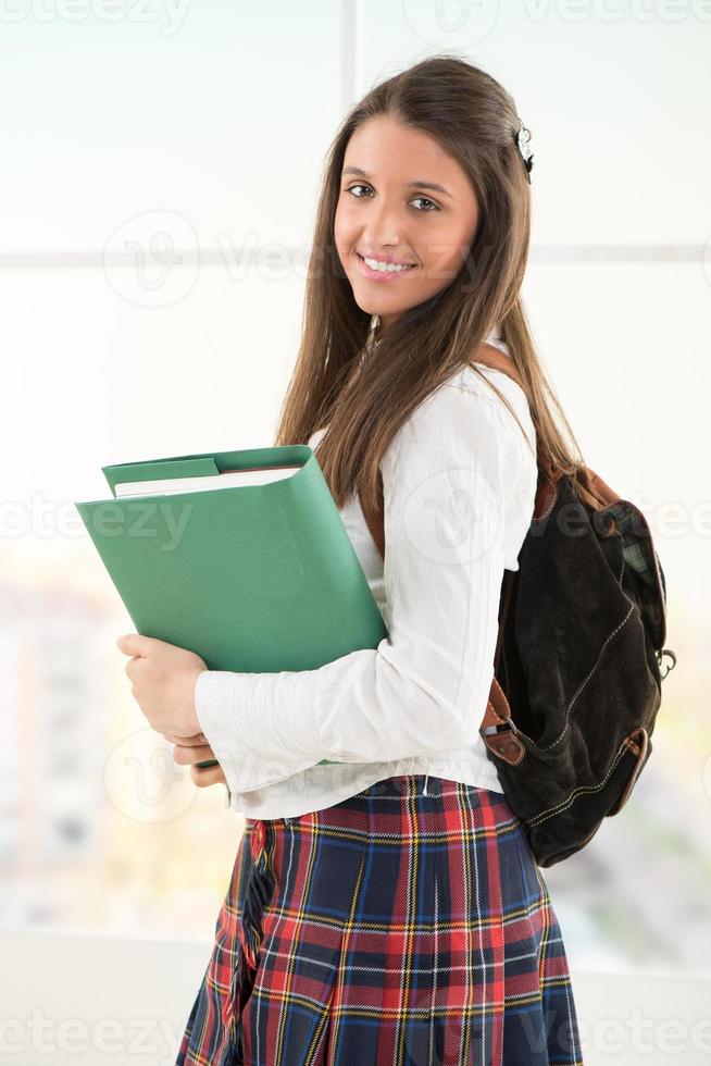 Happy Female student with books photo