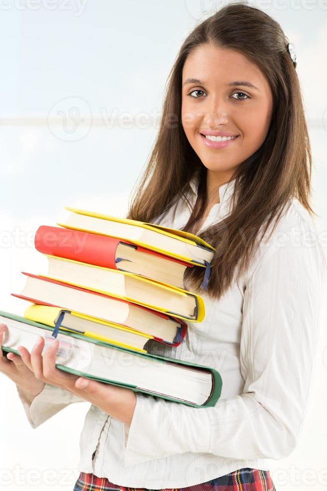 Happy Female student with books photo