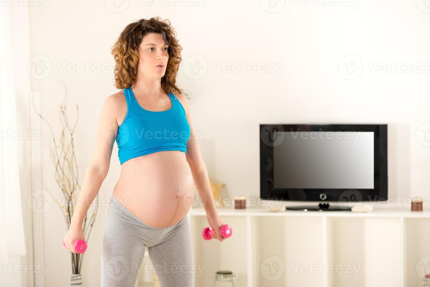 Pregnant Women Doing Breathing Exercises photo