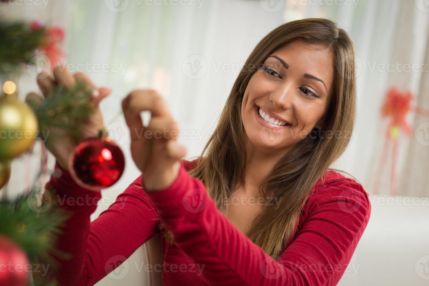 Girl Decorating Christmas Tree photo