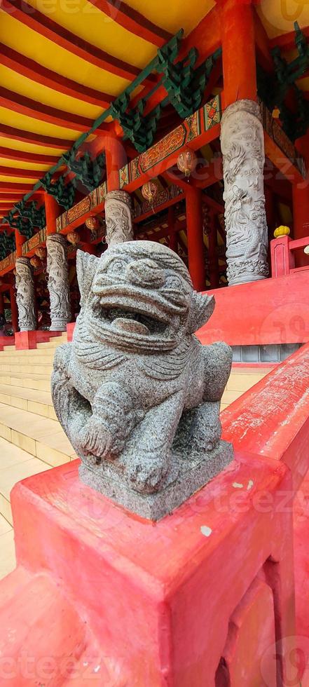 A photo of a small dragon statue made of stone at the Sam Poo Kong Temple Semarang.