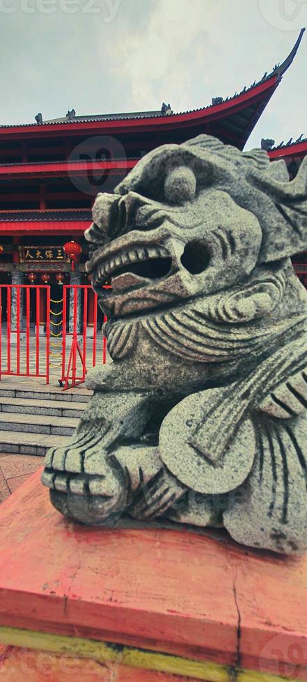 A photo of a small dragon statue made of stone at the Sam Poo Kong Temple Semarang.