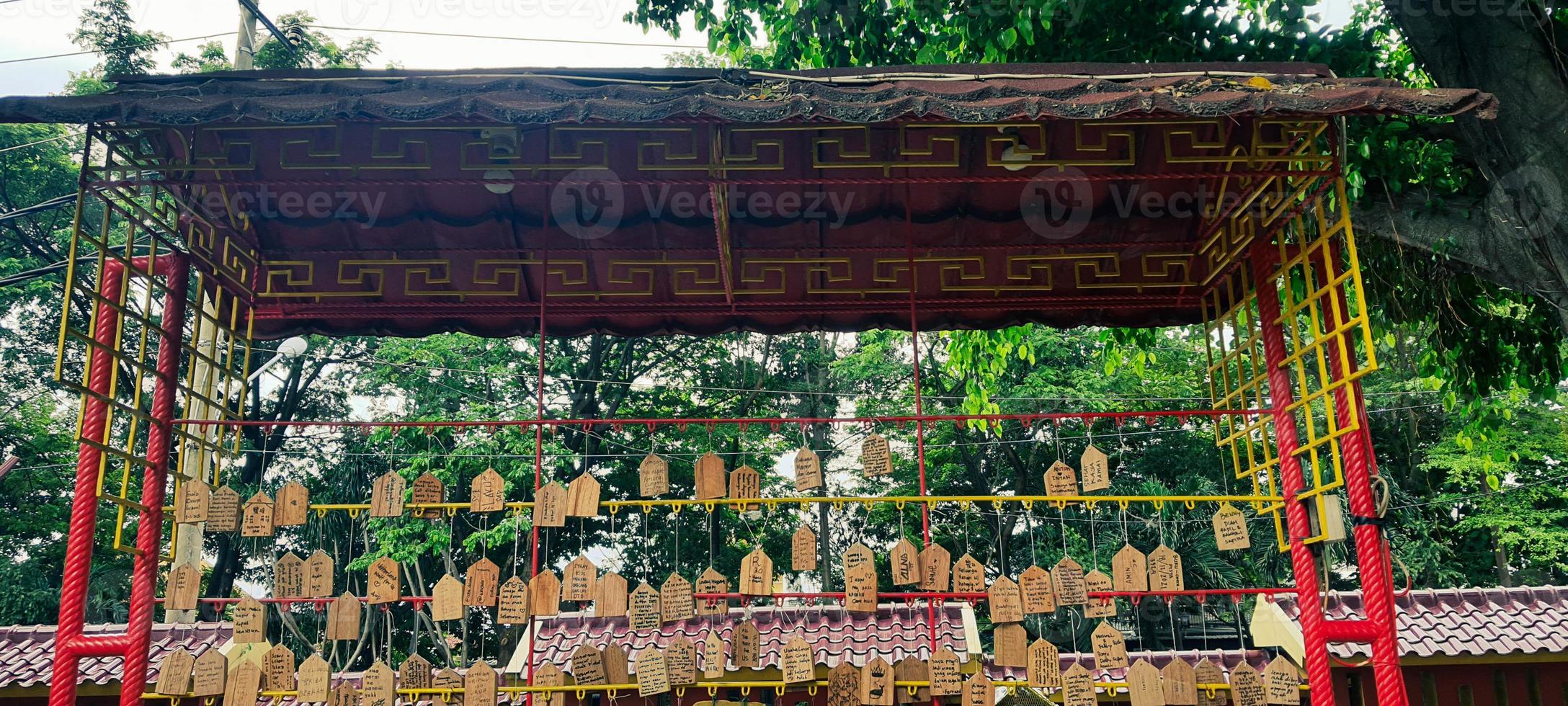 Prayers written on wood and hung in the Sam Poo Kong Temple area of Semarang. photo