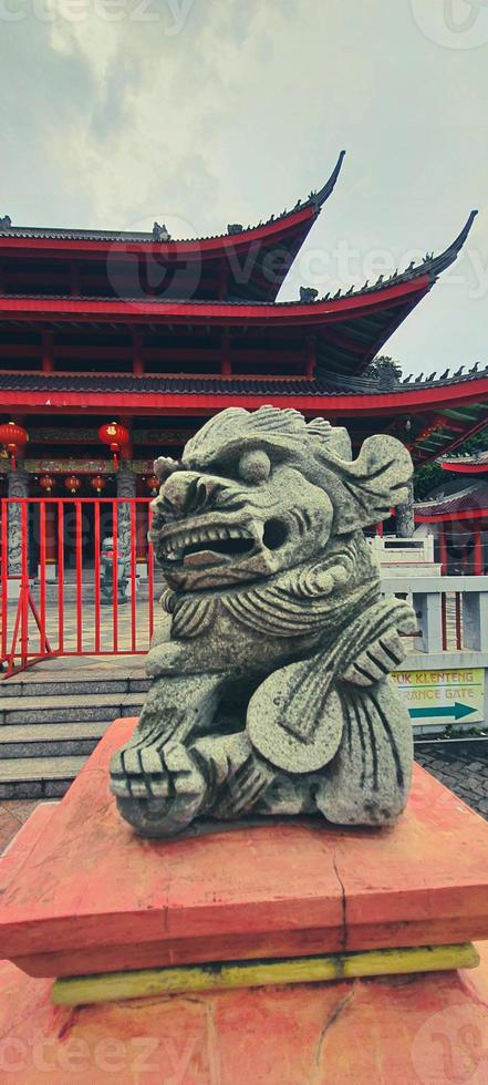 A photo of a small dragon statue made of stone at the Sam Poo Kong Temple Semarang.