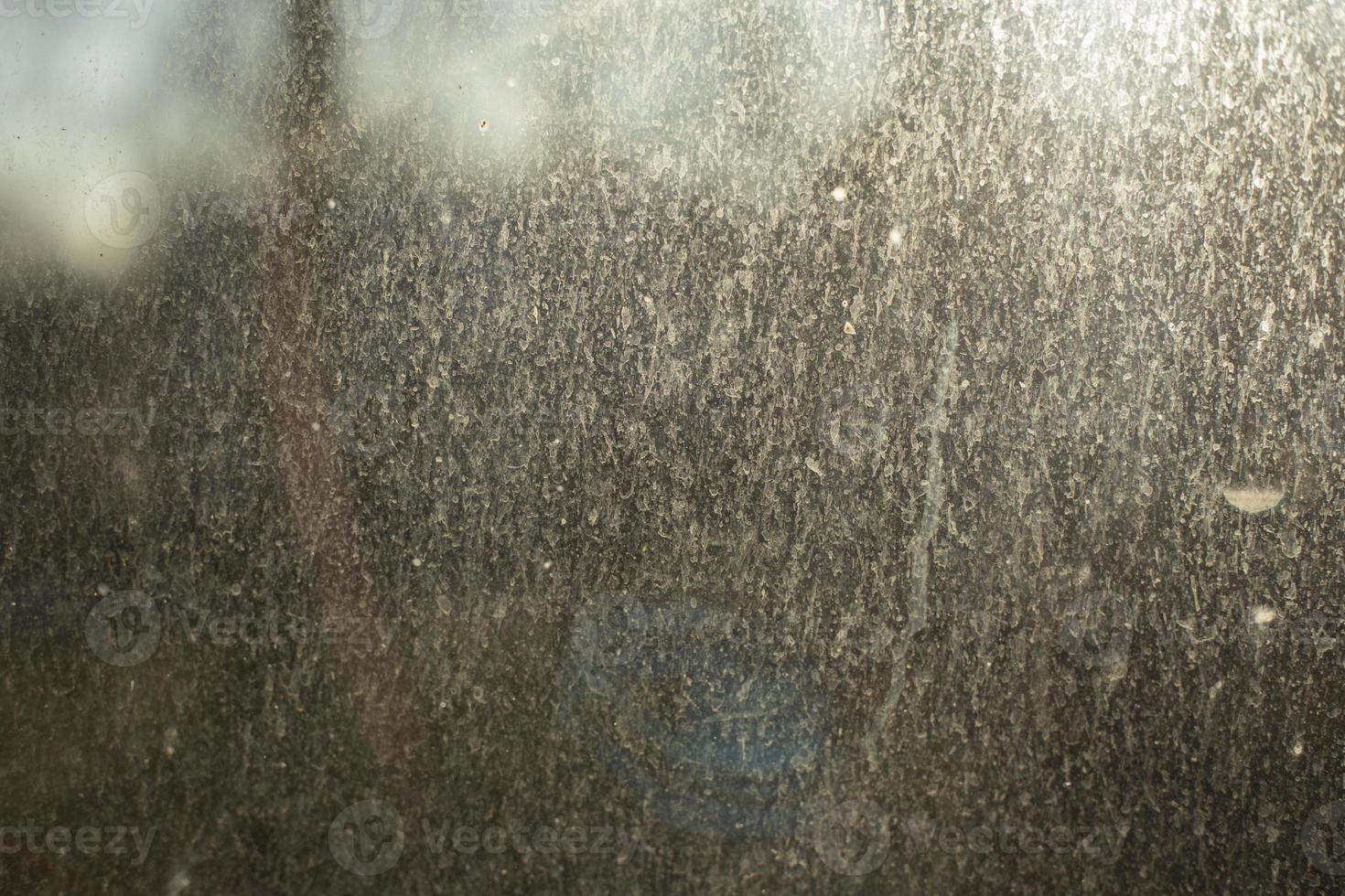 Dust on glass. Dirty window in morning. Surface in fine sand. 14161060