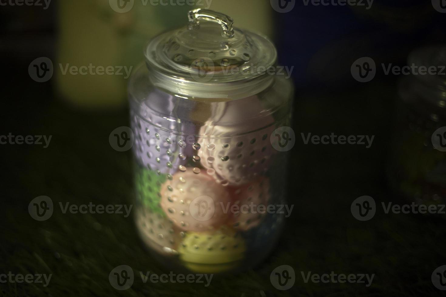 Sweets in park. Sweet treats in glass. Jar with lid. Marshmallow storage. photo