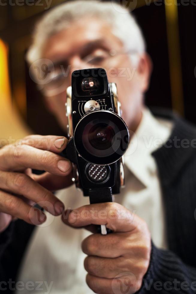 Senior Man Holding Video Camera photo