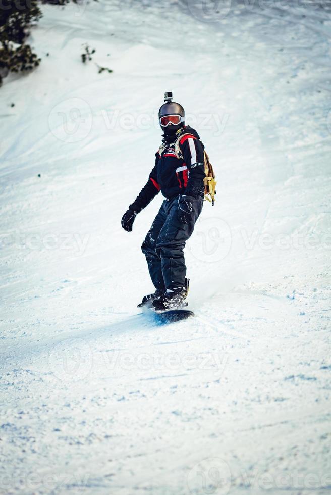 Snowboarder on snow photo