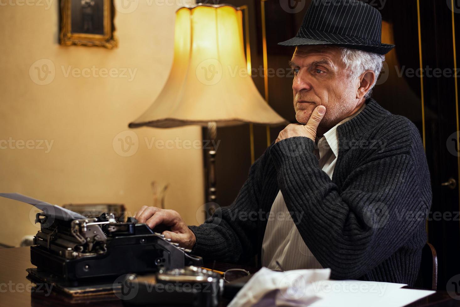Wistful Retro Senior Man Writer photo