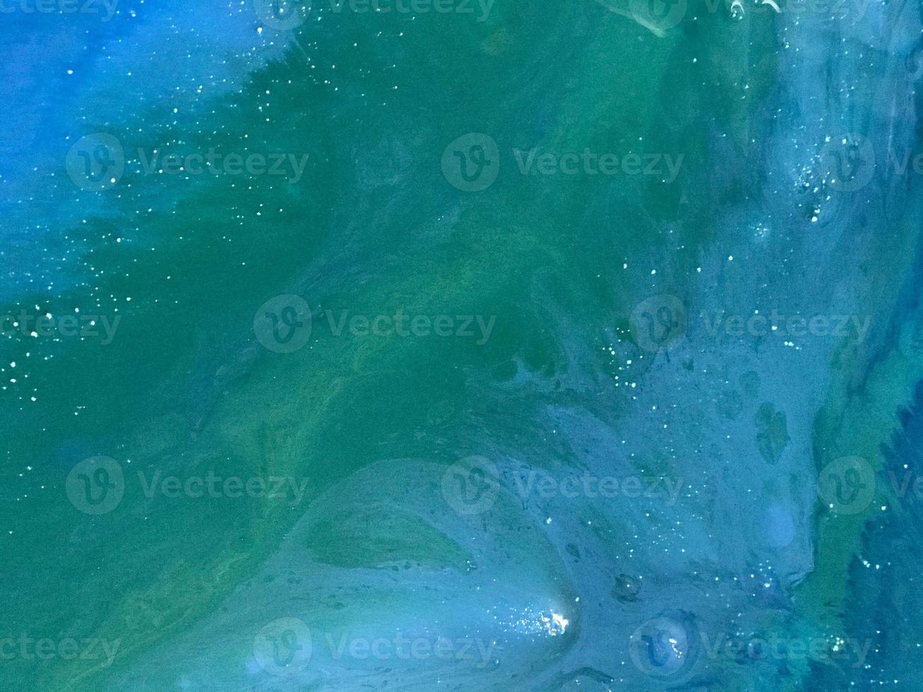 Abstract background of colored epoxy in marine theme. white bubbles on canvas made of wood. drawn wave by sea with potala and colored powders. Background to create pictures photo