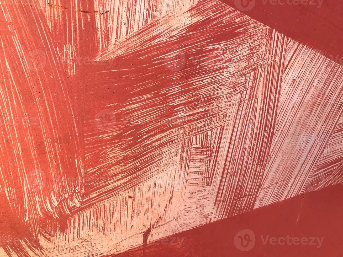 Texture metal iron red ragged scratched old painted with paint with embossed lines and stains. The background photo