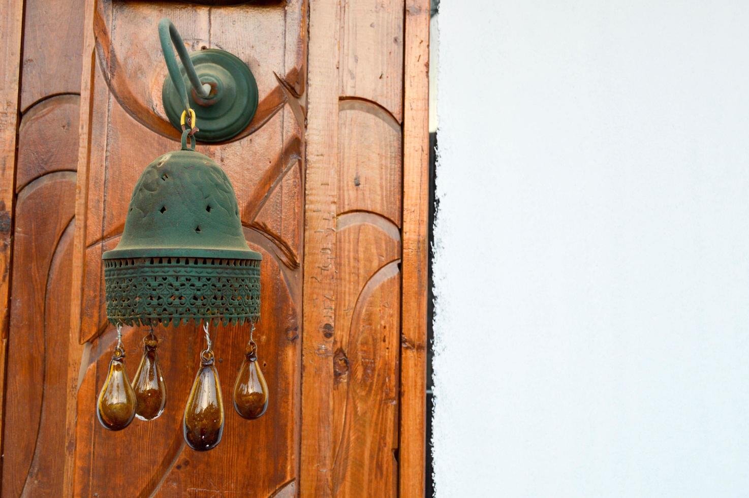 The edges of the Egyptian traditional bell tower bell on the building with brown glass balls are dripping. Arab Islamic Islamic decoration of buildings photo