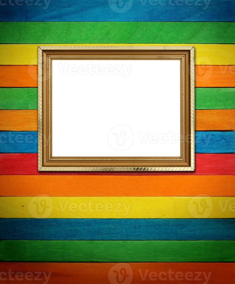 Gold frame on colorful wood Background photo