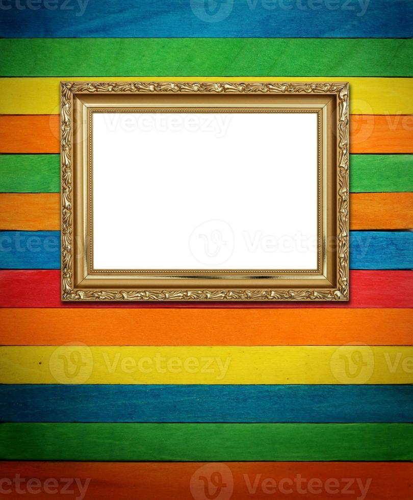 Gold frame on colorful wood Background photo