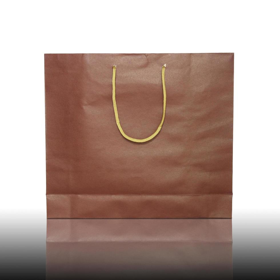 red shopping bag on reflect floor and white background photo