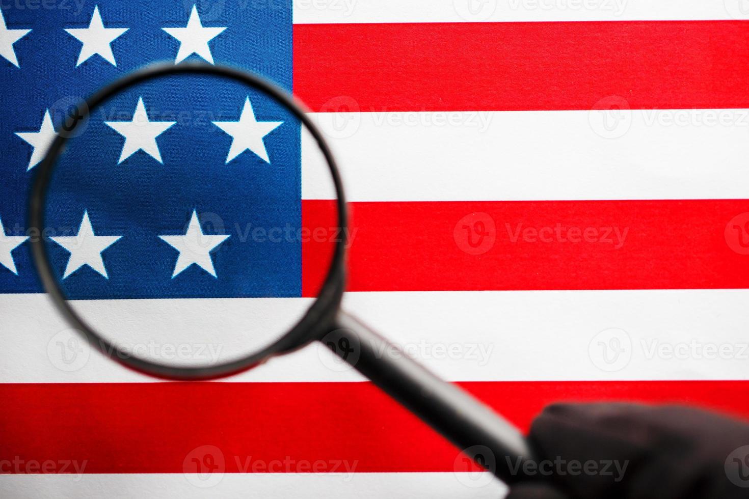 US flag looking through a magnifying glass. Study of the history and culture of the country of the United States. The concept of studying geography, English and customs photo