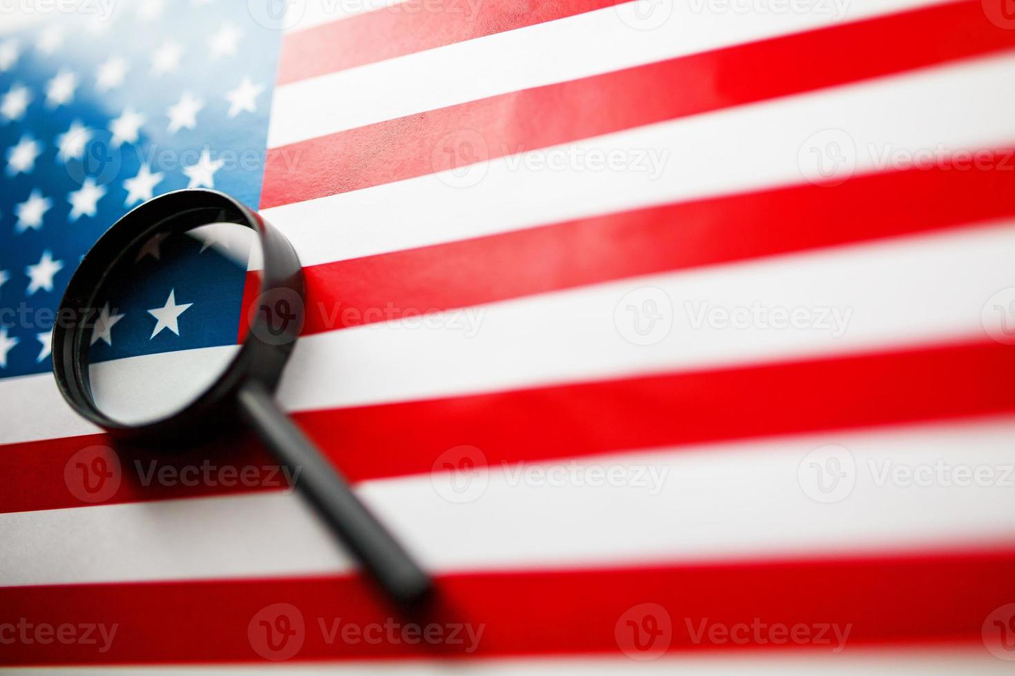 US flag looking through a magnifying glass. Study of the history and culture of the country of the United States. The concept of studying geography, English and customs photo