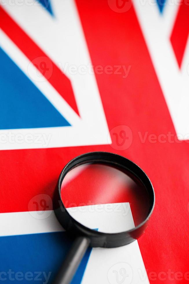 UK flag looking through a magnifying glass. The study of the history and culture of the people of the great country of England. The concept of studying geography, customs and the language photo