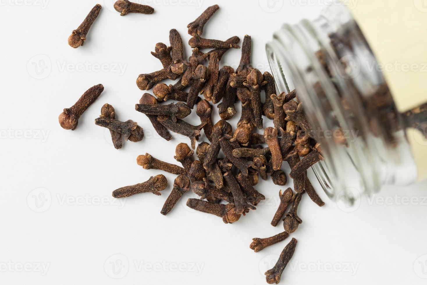 Whole Cloves Spice Spilled from a Jar photo