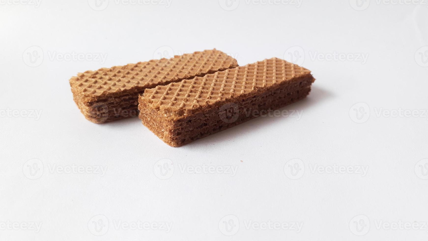 Tasty wafer sticks on white background, flat lay. Sweet food photo