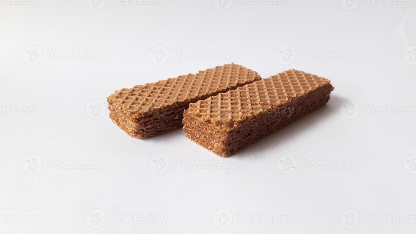 Tasty wafer sticks on white background, flat lay. Sweet food photo