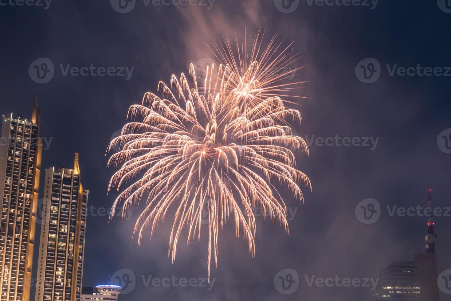 fireworks celebration on the river in the dark sky photo