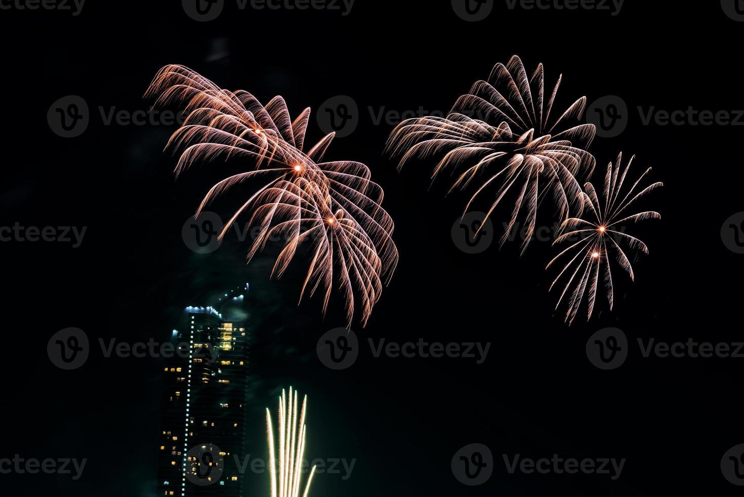 fireworks celebration on the river in the dark sky photo