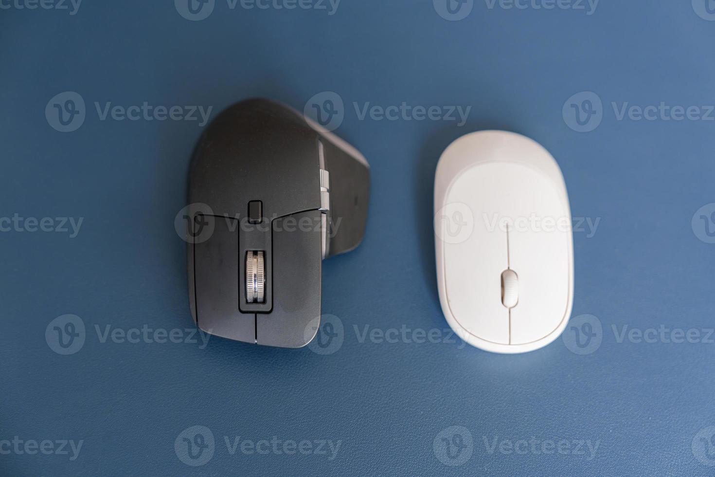 Comparison of Ergonomic vertical mouse and general mouse on desk at workplace, prevention wrist pain. De Quervain s tenosynovitis, Intersection Symptom, Carpal Tunnel or Office syndrome concept photo
