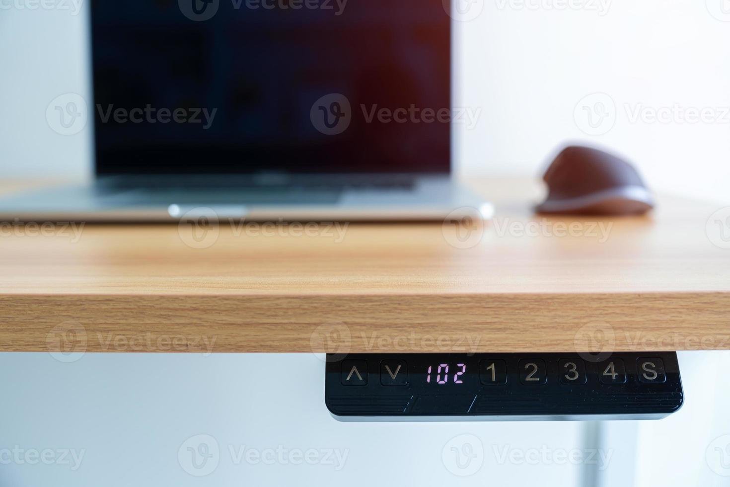 Ergonomic electric desk or Adjustable height table when working long time for Good posture to avoid Office syndrome, Back Pain, shoulder ache, scapular, fibromyalgia, Neck, piriformis photo