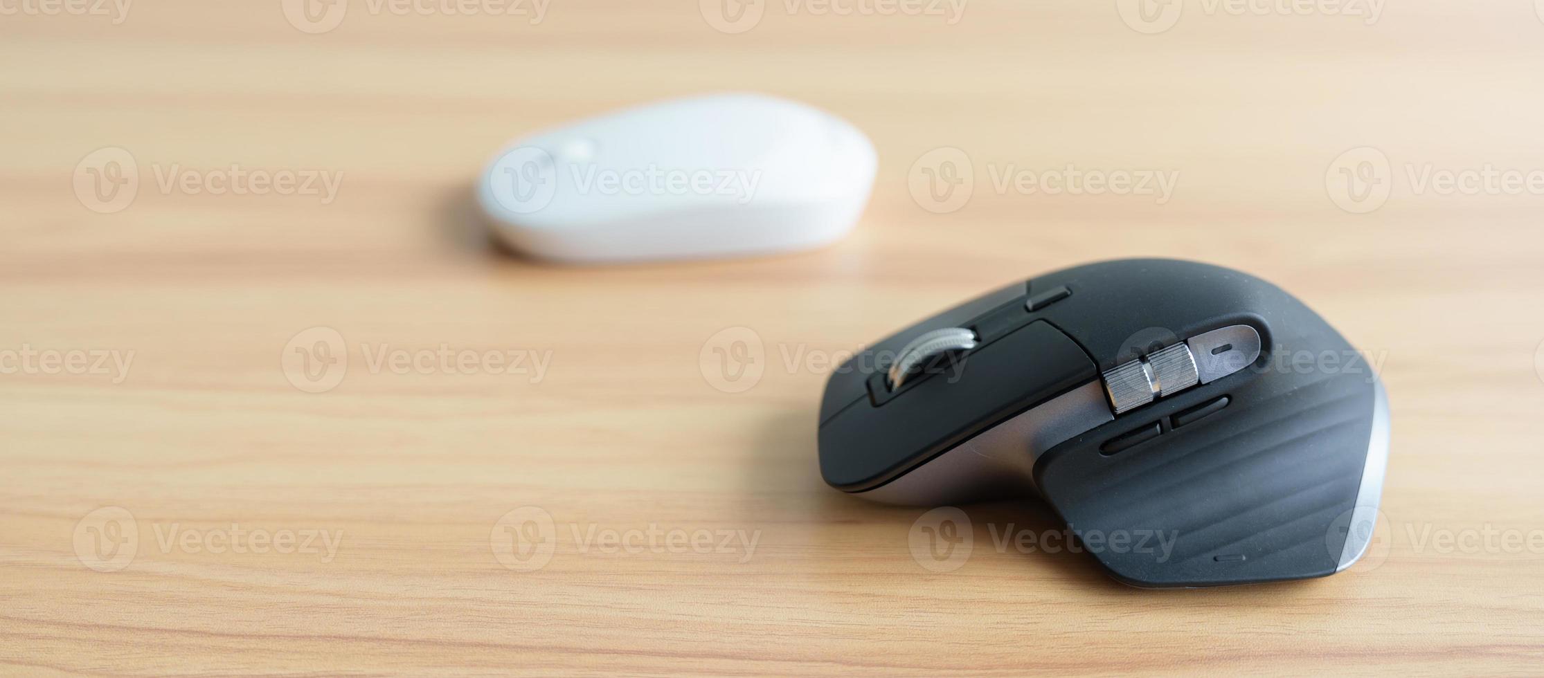 Comparison of Ergonomic vertical mouse and general mouse on desk at workplace, prevention wrist pain. De Quervain s tenosynovitis, Intersection Symptom, Carpal Tunnel or Office syndrome concept photo