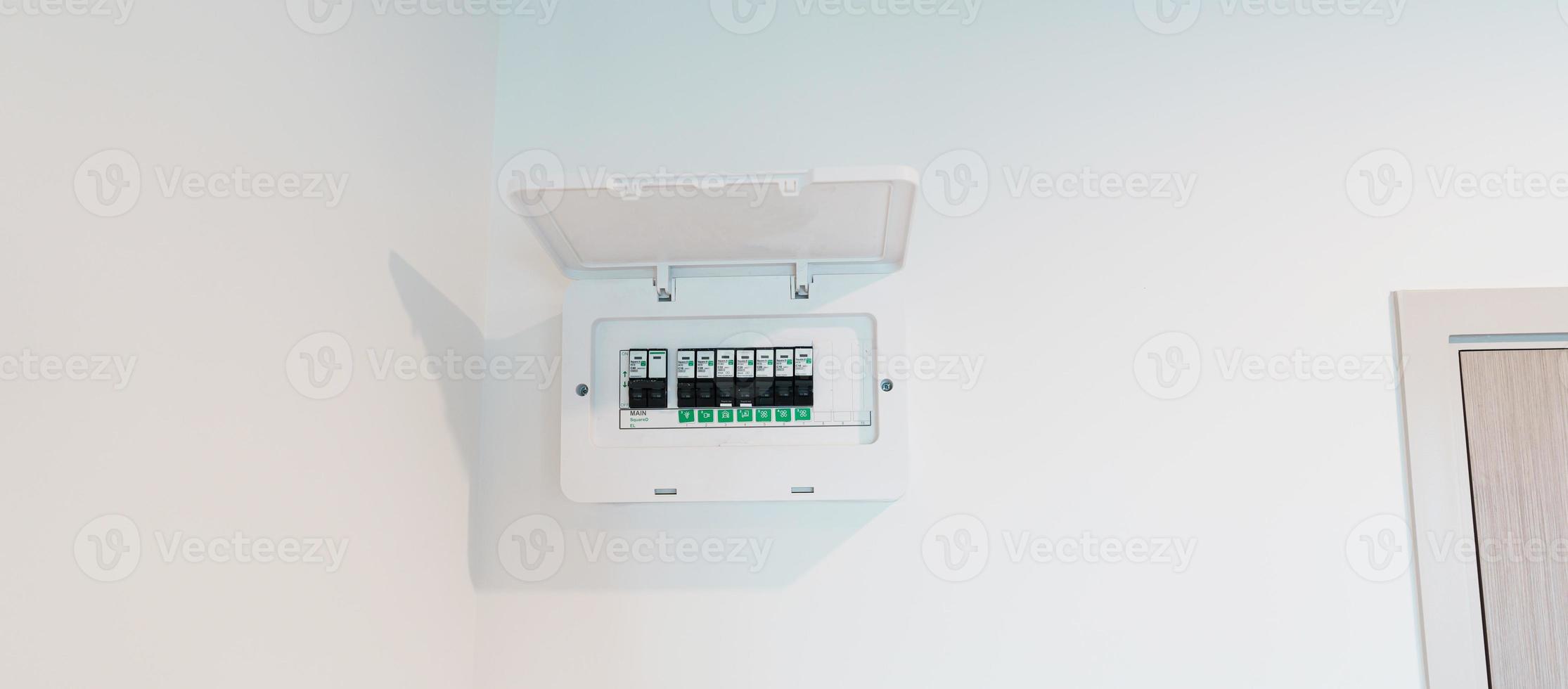 Fuse board box in apartment room. Electrical power switch panel. Electricity equipment and security concept photo