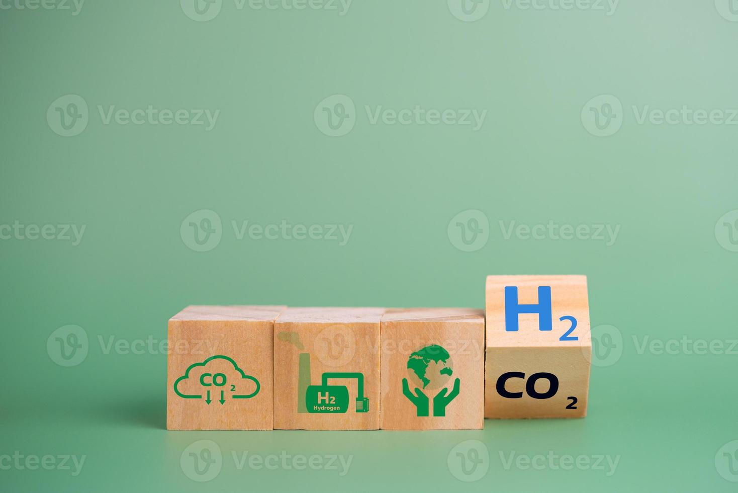 Hydrogen fuel is used to replace carbon dioxide, helping to reduce global warming. wood cube icon H2 hydrogen. photo