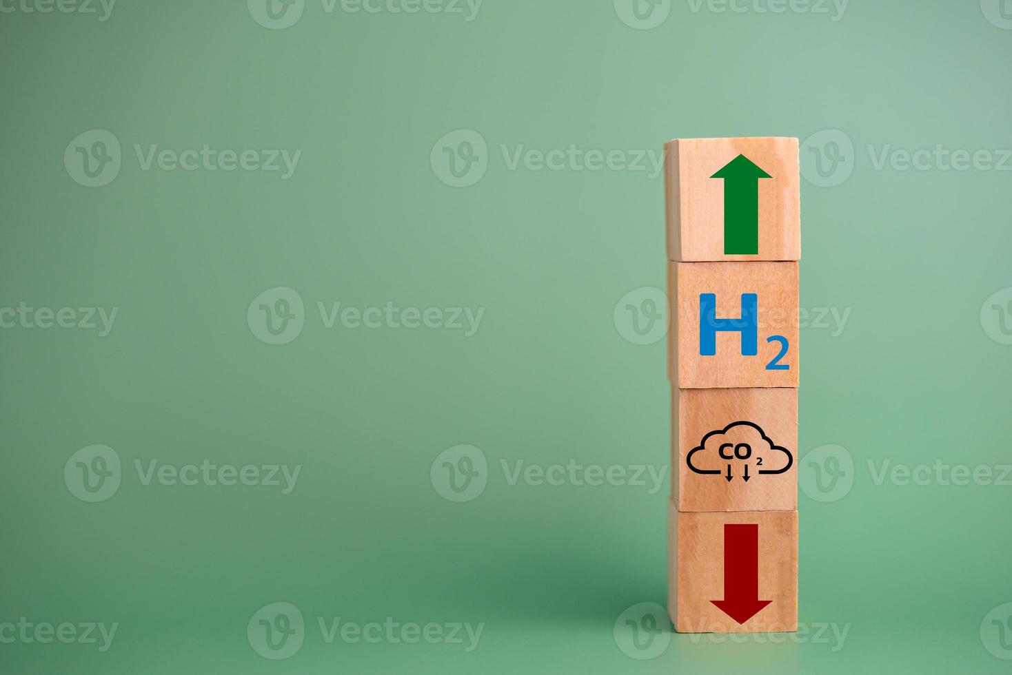 Hydrogen fuel is used to replace carbon dioxide, helping to reduce global warming. wood cube icon H2 hydrogen. photo