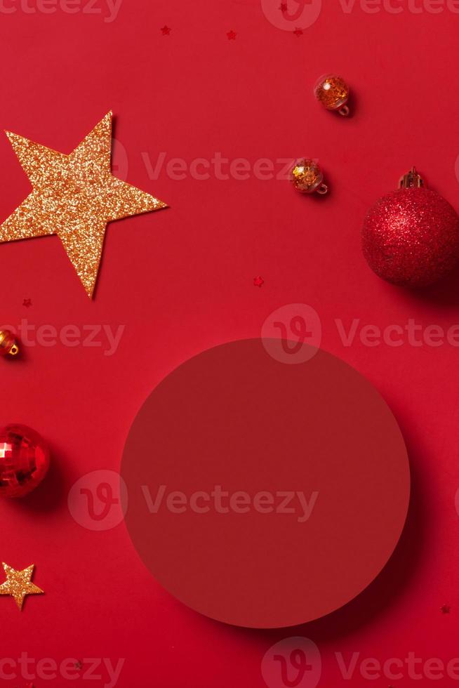 Mock up podium or pedestal for skincare beauty products and Christmas decorations top view on red background photo