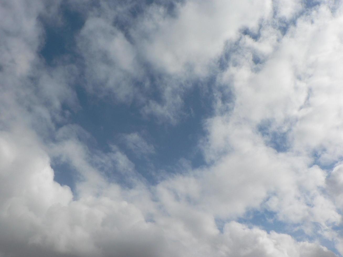 Beautiful blue sky with clouds background. Sky clouds. Air and fluffy clouds in the blue sky on a sunny day, background texture. Copy space. The concept of hope. photo