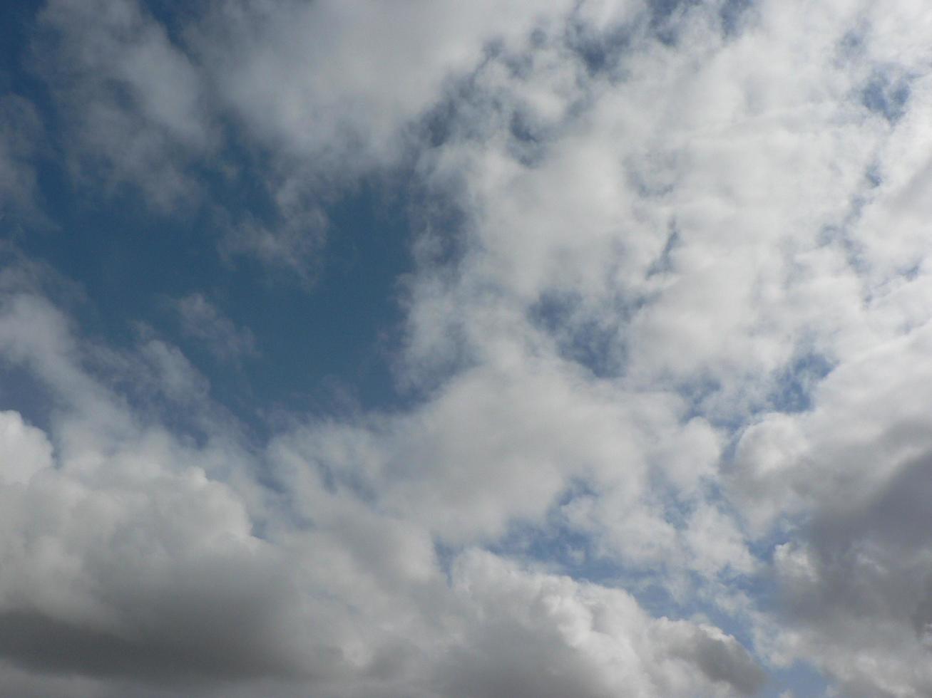 Beautiful blue sky with clouds background. Sky clouds. Air and fluffy clouds in the blue sky on a sunny day, background texture. Copy space. The concept of hope. photo
