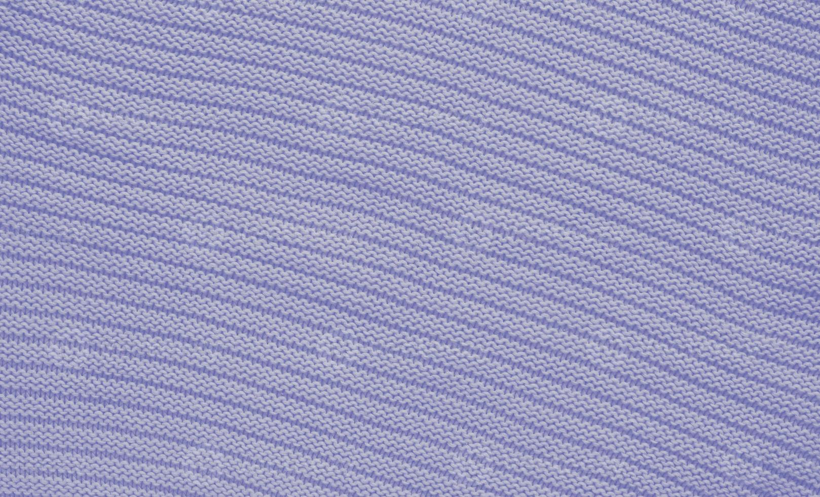 Texture of smooth knitted sweater with pattern. Handmade knitting wool or cotton fabric texture. Background of knitting patterns with horizontal stripes. photo