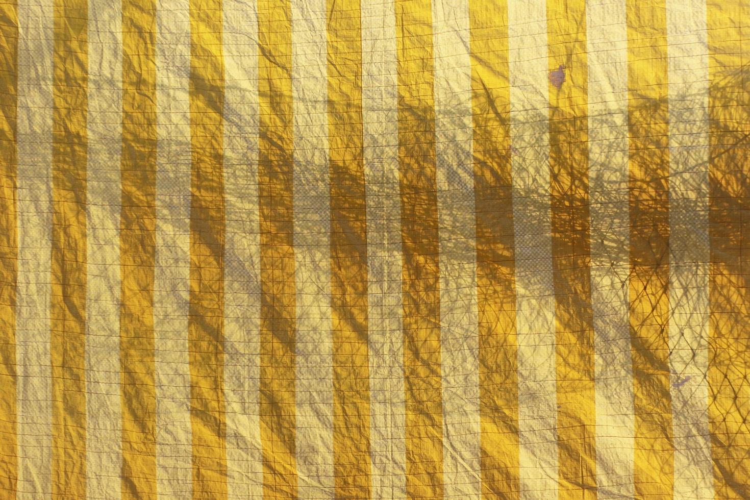 Plastic sheet pattern with shadow of net. Abstract background. photo