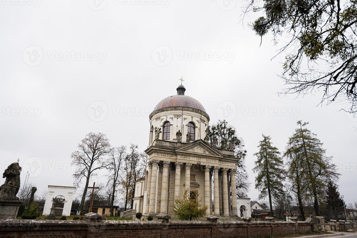 Baroque Roman Catholic church of St. Joseph mid 18th century. Latin on main facade - TO THE GLORY OF OUR LORD GOD, Pidhirtsi, Lviv Oblast, Ukraine. photo