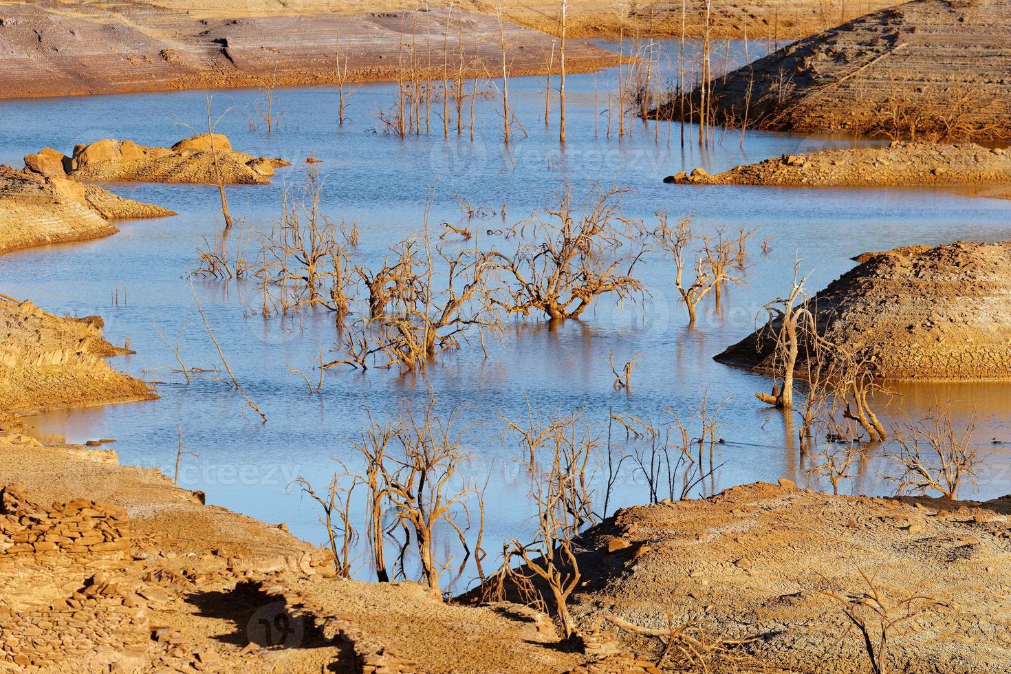 Low levels of water reservoir. Dry climate. Shortage of water. Climate change and global warming. There is no planet B. Urgent action to save the world. Minas de Riotinto in Spain. Environment. photo