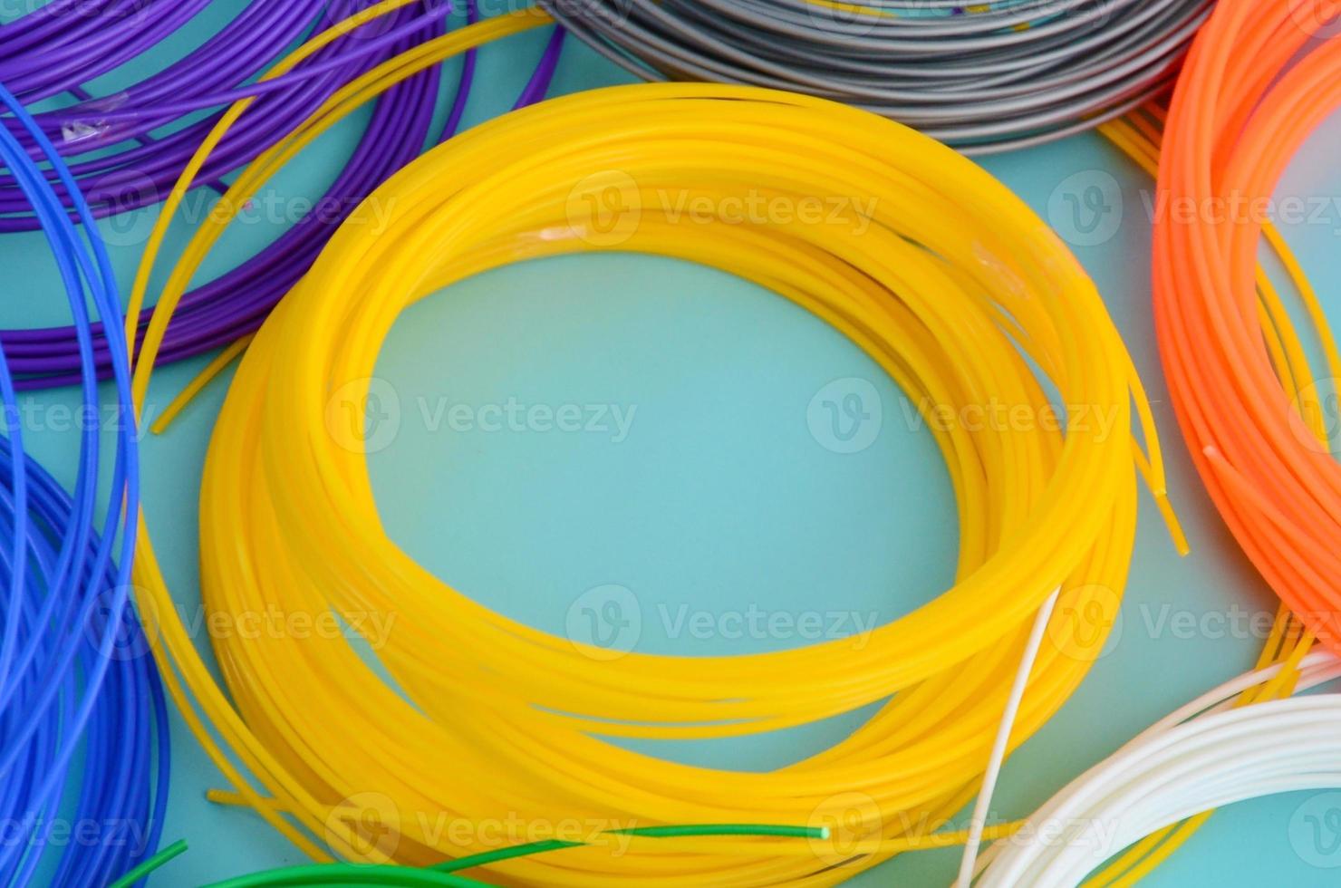 Plastic PLA and ABS filament material for printing on a 3D pen or printer of various colors photo