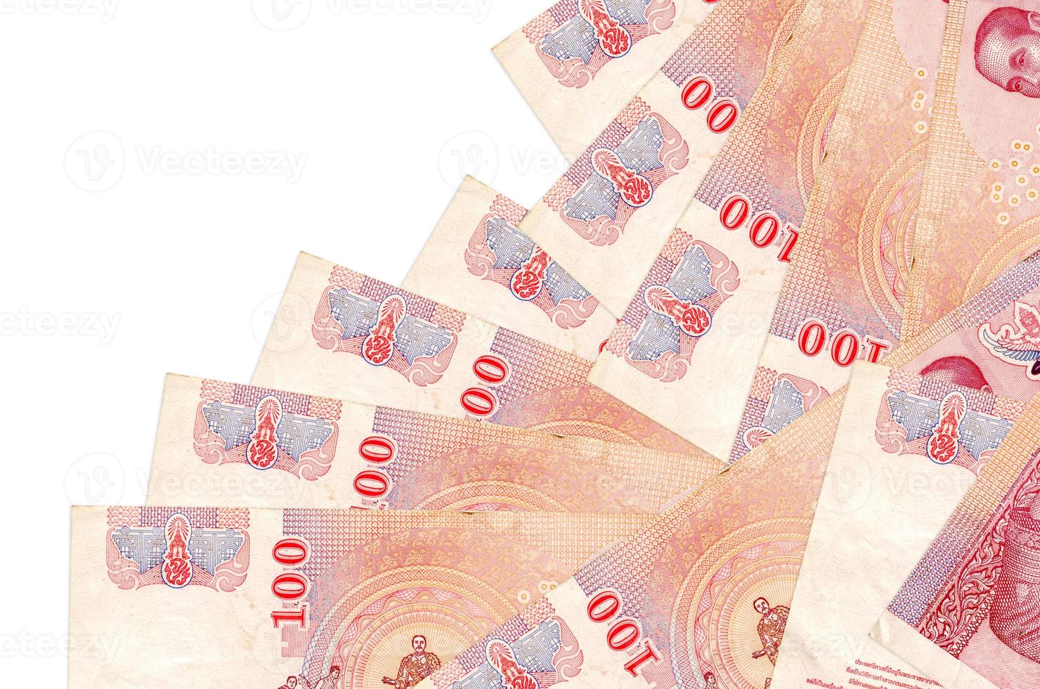100 Thai Baht bills lies in different order isolated on white. Local banking or money making concept photo