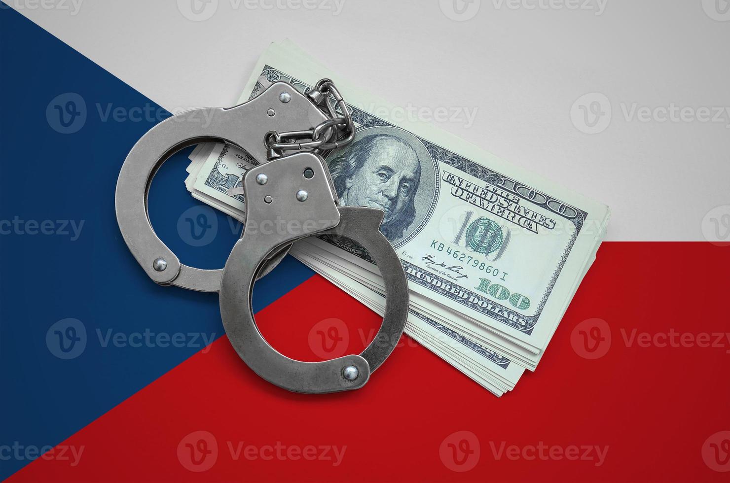 Czech flag  with handcuffs and a bundle of dollars. Currency corruption in the country. Financial crimes photo